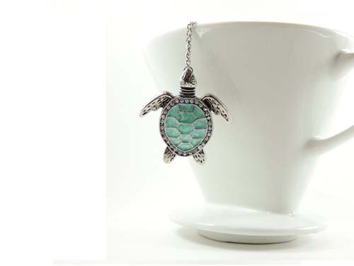 blue turtle pendant on a loose leaf tea ball infuser
